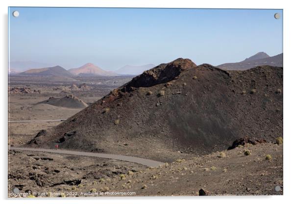 Lone figure walking in the Timanfaya National Park Acrylic by Keith Bowser