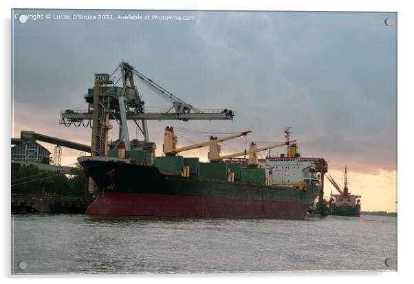 A ship at a harbor at sunset with heavy cranes in the background Acrylic by Lucas D'Souza