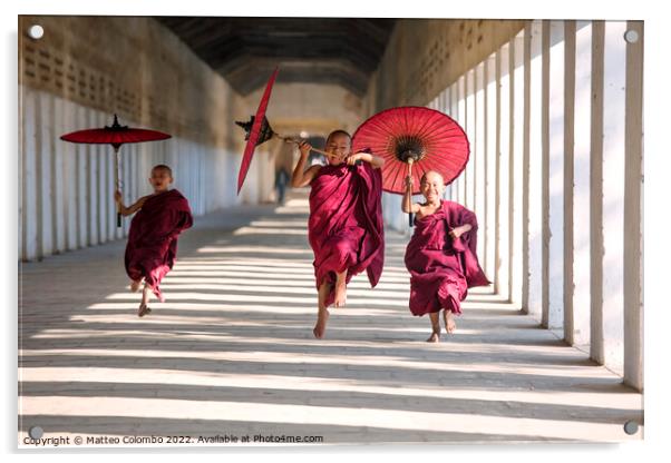 Novice monks with umbrellas running at temple, Bagan, Myanmar Acrylic by Matteo Colombo