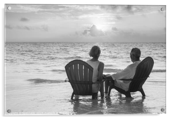 Retired couple enjoying sunset view over ocean Bahamas Acrylic by Spotmatik 