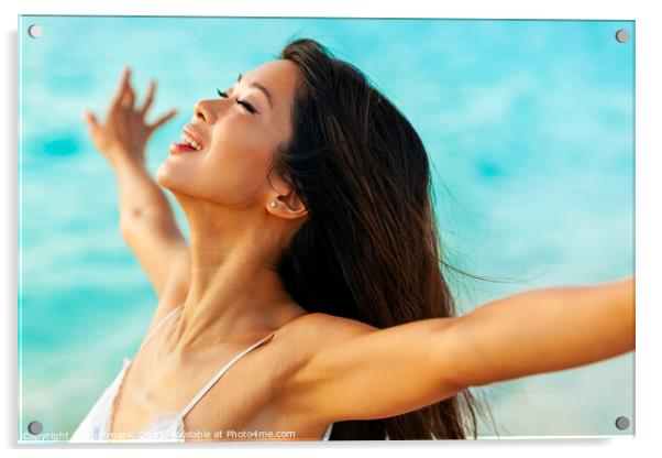 Asian girl enjoying freedom outdoors by the ocean Acrylic by Spotmatik 