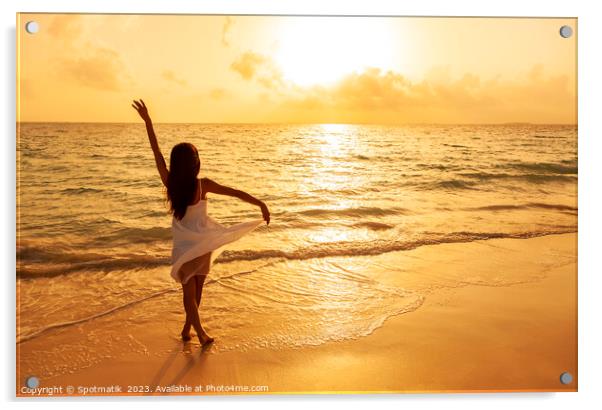 Asian girl standing in ocean waves at sunrise Acrylic by Spotmatik 