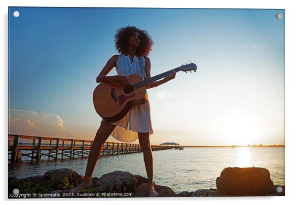 Young African American woman playing guitar at sunrise Acrylic by Spotmatik 