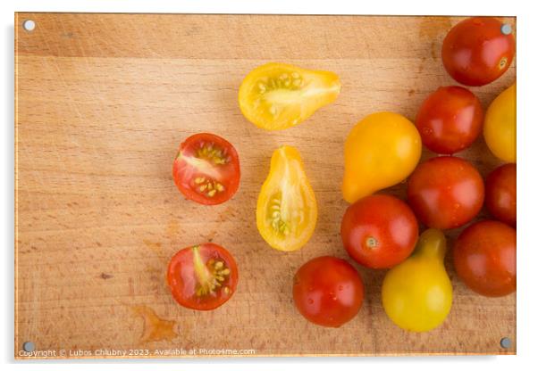 Red and yellow cherry tomatoes on a wooden cutting board Acrylic by Lubos Chlubny