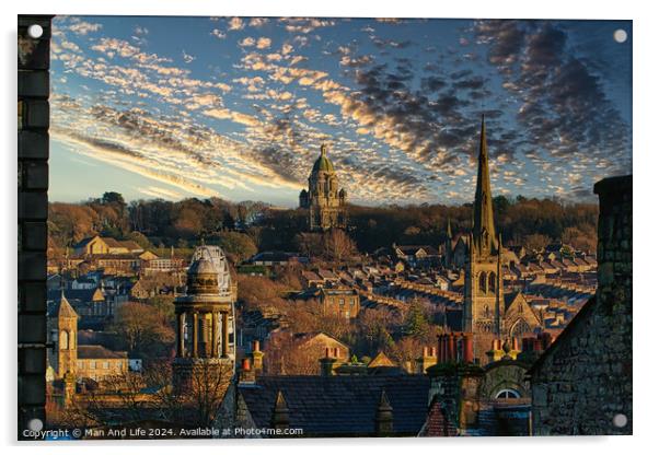 Historic cityscape at sunset with dramatic clouds, showcasing architectural landmarks and a warm golden light bathing the buildings in Lancaster. Acrylic by Man And Life