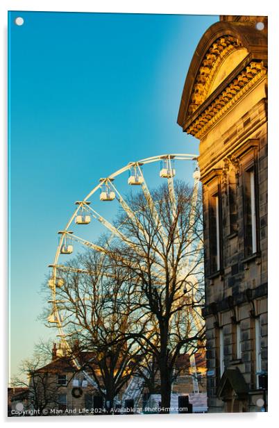 Historic building corner with a Ferris wheel and tree silhouettes against a clear blue sky at sunset in Lancaster. Acrylic by Man And Life