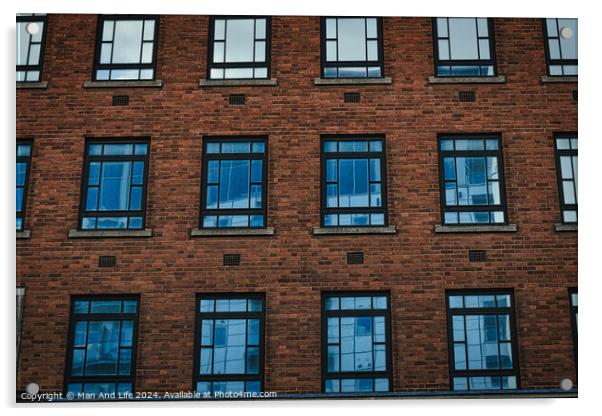 Symmetrical brick building facade with rows of blue windows, urban architecture background in Leeds, UK. Acrylic by Man And Life