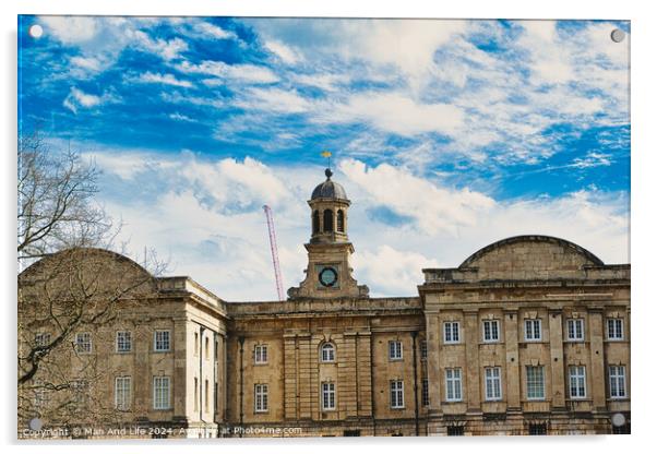 Historic stone building with a central clock tower under a blue sky with fluffy clouds, featuring classic architecture and a construction crane in the background in York, North Yorkshire, England. Acrylic by Man And Life