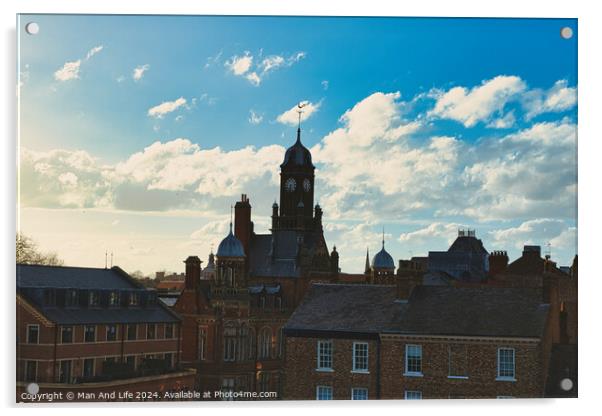 Vintage European architecture with a clock tower against a backdrop of a dramatic sky with fluffy clouds, capturing the essence of a historic town at sunset in York, North Yorkshire, England. Acrylic by Man And Life