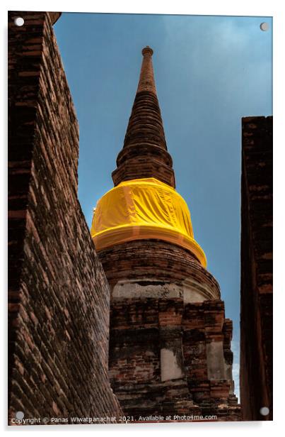An ancient pagoda behind a brick building Acrylic by Panas Wiwatpanachat