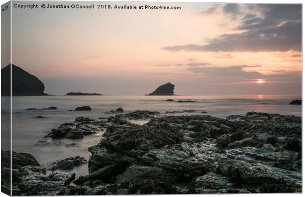 Sunset Over Rocks - Portreath Cornwall UK Canvas Print by Jonathan OConnell