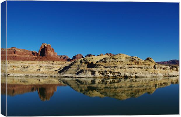 Red and white rock reflection in Colorado River Canvas Print by Claudio Del Luongo