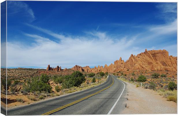 Road through rock wonders, Utah Canvas Print by Claudio Del Luongo