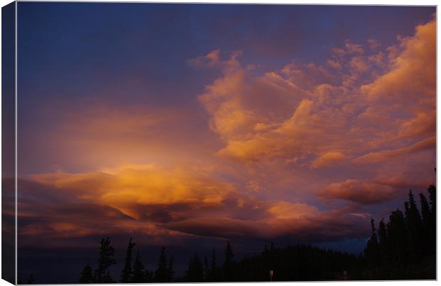 Colourful evening clouds, Rocky Mountains, Colorad Canvas Print by Claudio Del Luongo