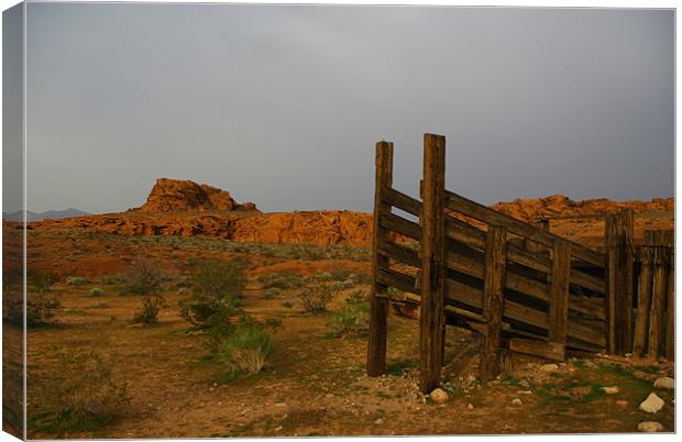 Old corral and red rocks Canvas Print by Claudio Del Luongo
