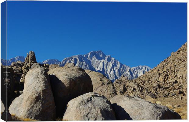 Rocks and highest Sierra Nevada peaks, California Canvas Print by Claudio Del Luongo