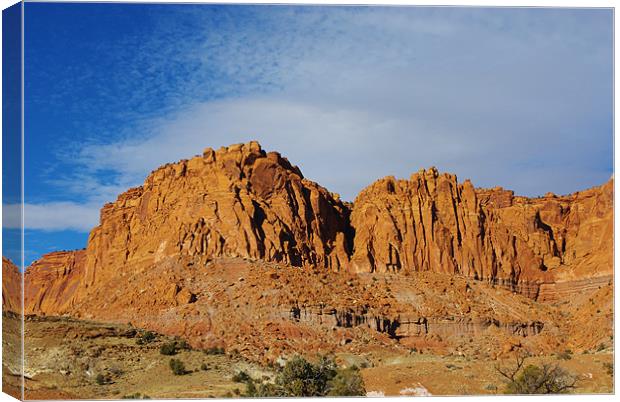 Red rock walls under blue and white sky, Utah Canvas Print by Claudio Del Luongo