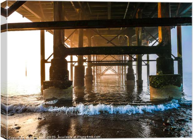 Under The Pier Canvas Print by Dave Bell