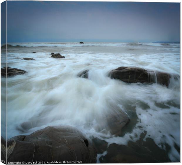 Rocky Sea Shore Foaming Water Canvas Print by Dave Bell