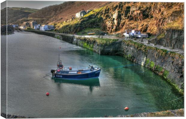 Solitary Fishing Boat Moored In Cornish Port Canvas Print by Dave Bell