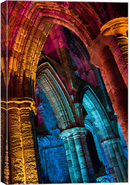 Whitby Abbey Illuminated for Halloween Canvas Print by Martin Williams