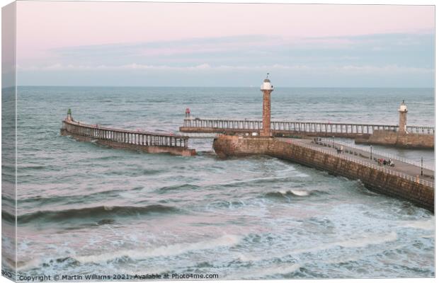 Whitby piers viewed from West Cliff Canvas Print by Martin Williams