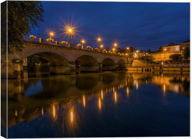 Cognac Bridge by Night, Cognac, France Canvas Print by Mark Llewellyn