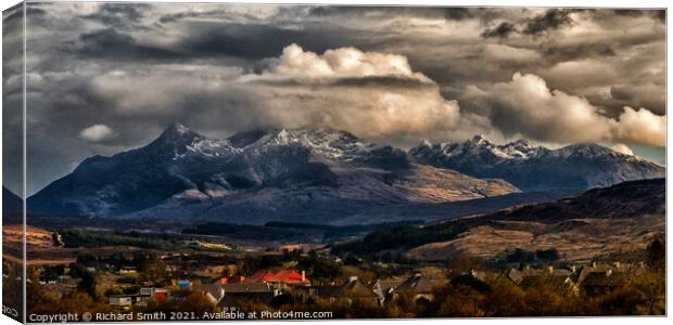 The dramatic Black Cuillin Hills beyond Portree. Canvas Print by Richard Smith