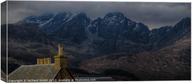 The roof and chimneys of the Torrin Outdoor Centre set against Blaven.  Canvas Print by Richard Smith