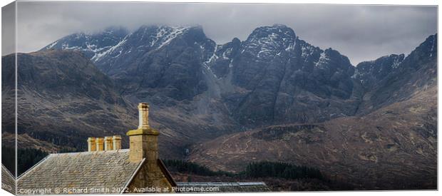 The roof and chimneys of the Torrin Outdoor Centre set against Blaven, brightened.  Canvas Print by Richard Smith