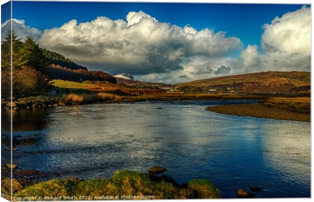 Clouds and blue sky reflected in the river Varragill. Canvas Print by Richard Smith