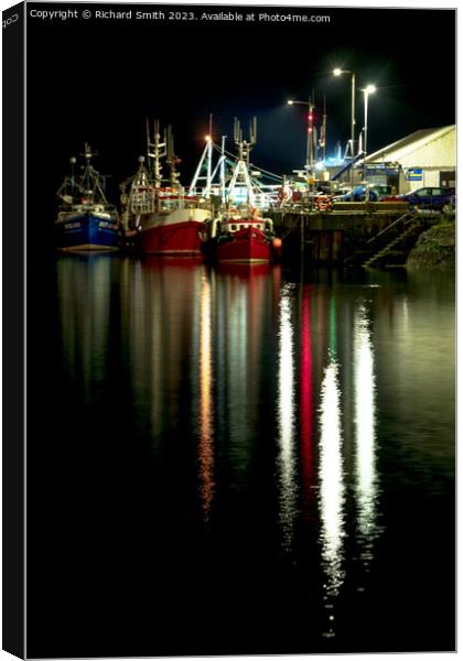 Fishing vessels moored to Portree pier at night Canvas Print by Richard Smith