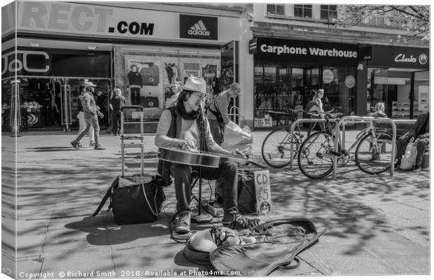 Street busker and his dog. Canvas Print by Richard Smith