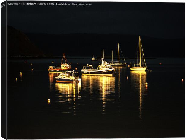 A selection of sea vessels moored in Loch Portree overnight. Canvas Print by Richard Smith