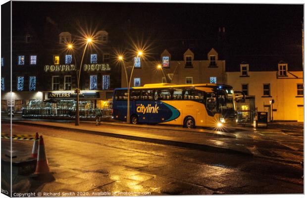 A citylink bus from Glasgow arrives in Portree. Canvas Print by Richard Smith