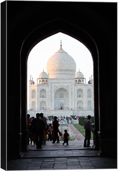 Taj Mahal Through Arch Canvas Print by Louise Wilson