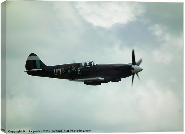 Spitfire In The Clouds Canvas Print by mike jordan