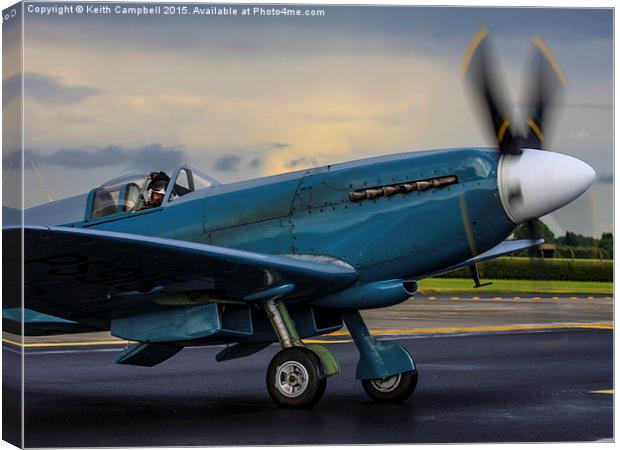 Spitfire PS915 starting. Canvas Print by Keith Campbell