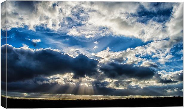 Breaking in the clouds, revealing the rays of beau Canvas Print by