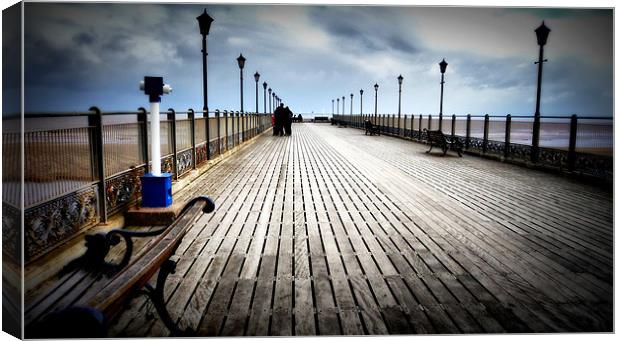 Along the Pier Canvas Print by Jon Fixter