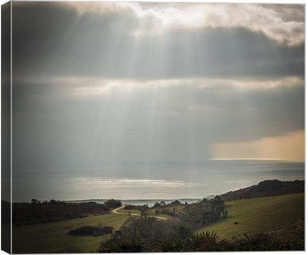 Rays over the Coastline Canvas Print by Ian Johnston  LRPS