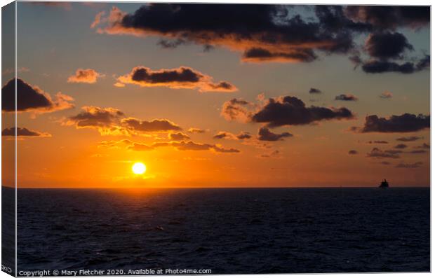 Sunrise over the water Canvas Print by Mary Fletcher