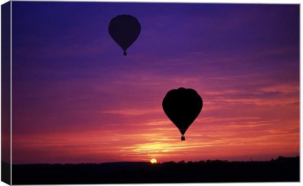 Balloons at Sunset Canvas Print by Peter Cope