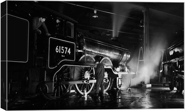 Oiling up a steam loco at night. Canvas Print by Ian Duffield