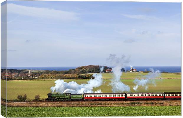 Steam train passing Weybourne.  Canvas Print by Ian Duffield