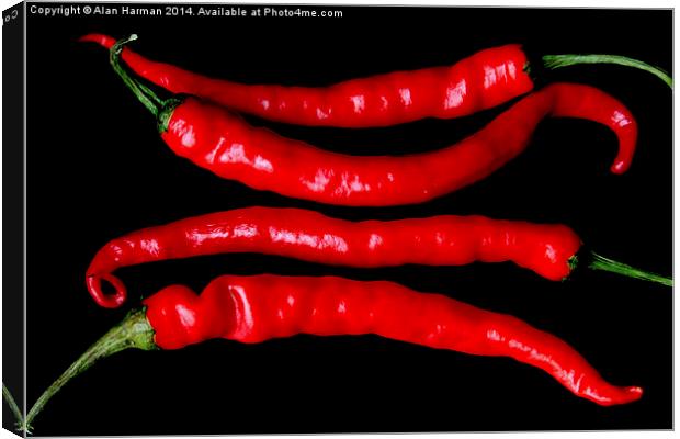 Four Red Chilies Canvas Print by Alan Harman