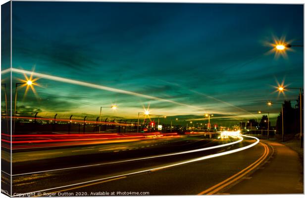 Heathrow never sleeps Canvas Print by Roger Dutton