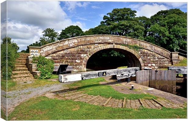 Canal Bridge and Lock Lancaster Canal Canvas Print by Gary Kenyon