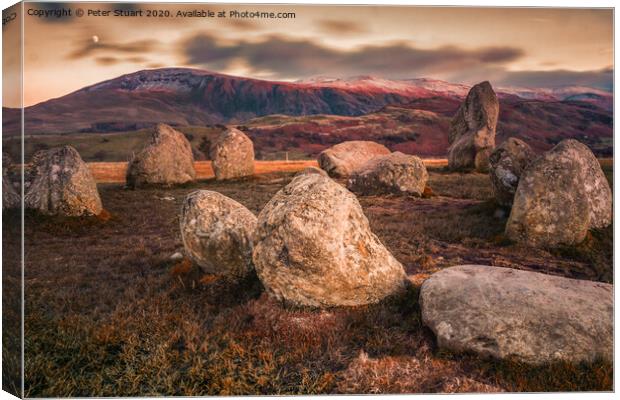 Castlerigg is perhaps the most atmospheric and dramatically sited of all British stone circles, with panoramic views and the mountains of Helvellyn and High Seat  Canvas Print by Peter Stuart