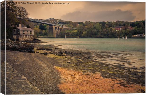 Boats sailing towards the Menai Bridge near Anglesey in North Wales Canvas Print by Peter Stuart